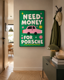 Need Money for Porsche poster in zwarte lijst aan de muur in een moderne hal met groene interieuraccenten