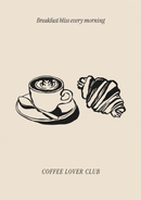 Een zwart getekende cappuccino op schotel en croissant onder Breakfast bliss every morning, met Coffee Lover Club op beige.