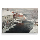 Rivière traversant un village enneigé