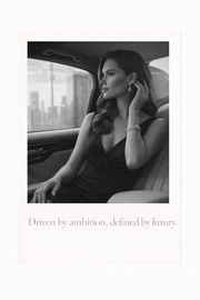 Zwart-wit poster van elegante vrouw in luxe auto met quote Driven by ambition defined by luxury