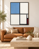 Piet Mondriaan - Composition with Blue and Red (1932) in een zwarte lijst boven een cognackleurige bank in een lichte woonkamer