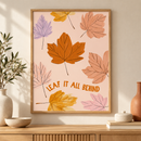 Leaf It All Behind herfstbladeren quote poster in houten lijst boven een eiken kast in een warm interieur