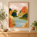 Autumn River herfstrivier landschapsposter in houten lijst boven een eiken kast in een warm interieur