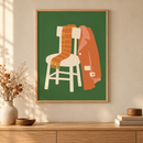Coat and Scarf in een houten lijst boven een eiken kast in een warm beige interieur