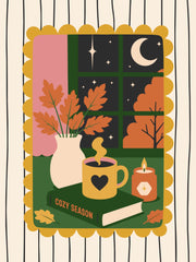 Raam met maan en sterren naast een vaas herfsttakken warme mok boek en kaars
