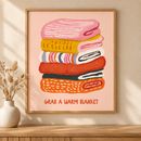 Grab a Warm Blanket in een houten lijst boven een eiken kast in een warm beige interieur