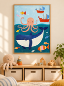Octopus en Walvis met Zeilboten in een houten lijst boven een speelgoedkast in een lichte kinderkamer
